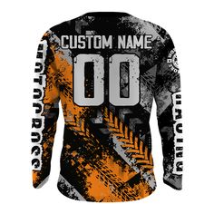 an orange and black long sleeve shirt with the words custom name in white on it