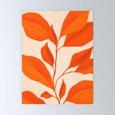 an orange and white painting with leaves on it