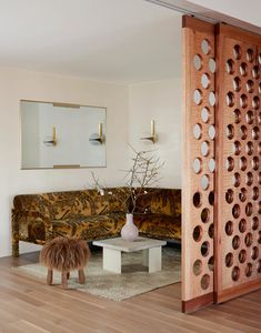 the living room is decorated in white and wood