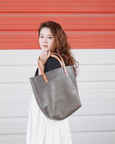 Brown Leather Bucket Bag With Rolled Handles, Vegetable Tanned Leather Tote Bag With Smooth Grain, Classic Leather Bucket Bag With Rolled Handles, Smooth Grain Tote Bucket Bag, Cool Grey Color, Classic Leather Tote, Tassel Keychain, Tote Bags Handmade, Tote Bag Leather