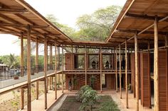 the inside of a building that is being constructed with wooden beams and wood slats