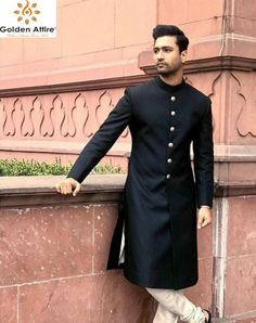 This is a Premium Sherwani by Golden Attire crafted from high quality fabric and imported materials. Our products are handcrafted by experienced tailors who make sure the that the stitching is precise, lining is proper and the overall product is sturdy enough to not go out of shape for more than a few years. Also all our products have extra margins in their length, sleeves, sides so it's easily alterable if your size changes after some time. To see more available colours and designs in this coll Elegant Nehru Jacket For Traditional Ceremonies, Elegant Nehru Jacket For Eid And Traditional Ceremonies, Elegant Nehru Jacket For Eid Ceremonies, Elegant Long Sherwani For Traditional Ceremonies, Traditional Semi-formal Sherwani With Pallu, Semi-formal Bollywood Style Fitted Sherwani, Fitted Bollywood Sherwani For Semi-formal Occasions, Black Sherwani With Pallu For Wedding, Elegant Long Bandhgala For Traditional Ceremonies