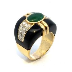 Fabulous emerald, diamond, and onyx cocktail ring handcrafted in 18 karat yellow gold. The band features a bezel set oval cabochon green emerald weighing approximately 4.00 carats, 24 round briliant cut diamonds weighing approximately 2.50 carat total weight, and onyx accent. The diamonds are graded H-I color and SI clarity. The ring measures 19.5mm in width tapering down to 6.5mm, and is currently size 8.5 (can be sized). Weight: 18.4 grams. Luxury Emerald Ring With Oval Cabochon And 17 Jewels, Luxury Oval Cabochon Emerald Ring With 17 Jewels, Luxury Emerald Ring With Oval Cabochon, Fine Jewelry Green Cabochons For Formal Occasions, Green Cabochons For Formal Fine Jewelry, Luxury Oval Cabochon Emerald Ring, Luxury Green Cabochons, Elegant Cabochon Emerald Ring For Formal Occasions, Modern Cabochon Emerald Ring For Formal Occasions