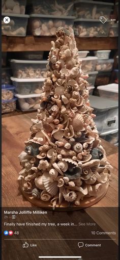 a christmas tree made out of seashells on a table