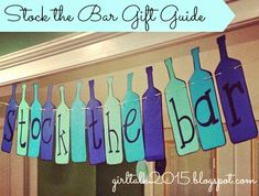 some wine bottles hanging from a line with the words save the bar gift guide on it