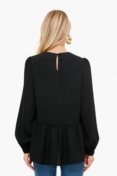 Flowy and flattering, the Carlota Peplum Blouse is a wardrobe must-have. This top features puff sleeves with elastic wrists, keyhole button back closure, high-low silhouette, and a peplum hem detail. Pair with denim and a change of accessories for a look that will take you from desk to drinks!

Crew neckline
Cuffed sleeves
Slightly puffed sleeves
High-low
Peplum detail
Material: 100% Polyester
Care: Hand wash cold Long Sleeve Peplum Top, Chain Scarf, Tennis Tops, Scarf Poncho, Fancy Party, Peplum Blouse, Peplum Hem, Monogram Styles, Puffed Sleeves