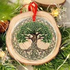 a wooden ornament with a tree on it