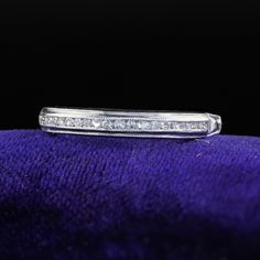 Beautiful Antique Art Deco Platinum Single Cut Diamond Engraved Half Band Ring. This classic Art Deco wedding band is crafted in platinum. The ring features single cut diamonds set on top of the band. The inside of the band is engraved "P, M. to A. C. 9/27/42". The ring is in great condition and sits low on the finger. Item #R2055 Metal: Platinum Weight: 2 Grams  Size: 5 Diamonds: Approximately .15 cts Color: H Clarity: VS2 Measurements: Top of the ring measures 2.91 mm wide and band measures 1.50 mm wide. Measurements off the finger: 1.69 mm high Layaway: For your convenience, we will be happy to provide layaway payment options. Please contact us to work out a layaway plan which best suits your needs. All layaway purchases are final sale. All domestic and international shipments are shipp Classic Eternity Band With Diamond Baguette Cut, Classic Eternity Band With Baguette Cut Diamond Accents, Classic Moissanite Channel Set Rings, Classic Moissanite Ring With Channel Set, Diamond Channel Set Promise Ring Bands, Diamond Channel Set Promise Ring, Diamond Channel Set Band For Promise Ring, Classic Diamond White Channel Set Eternity Band, Classic Diamond Ring With Channel Set