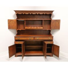 an old wooden desk with drawers and cupboards