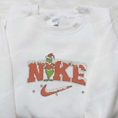 Introducing the Christmas Grinch x Nike Embroidered Shirt, a festive must-have for the holiday season! Designed with meticulous attention to Nike Inspired, Baby Grinch, Embroidered Apparel, Christmas Attire, Christmas Grinch, 3d Shirt, Family Christmas Gifts, Embroidered Sweatshirt, Embroidered Clothes