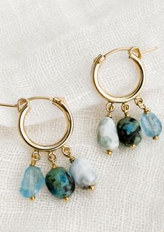 A pair of gold hoop earrings with triple turquoise dangling stones. Handmade 14k Gold Filled Dangle Huggie Earrings, Hoop Earrings With Natural Stones In 14k Gold Filled, Dainty 14k Gold-filled Earrings With Natural Stones, Small Gold Hoop Earrings, Small Gold Hoops, Gold Filled Hoops, Classic Earrings, Bow Earrings, Earring Sale