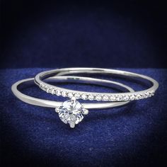 two white gold rings with diamonds on them