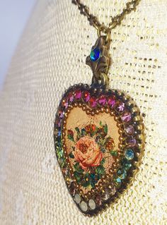 Michal Negrin heart necklace. With a Victorian Rose pattern and multicolor Swarovski crystals. The heart measures 1.25 inches high and 1.1 inches wide. The chain can be worn at 16 inches and 18 inches long. New in a gift box. For Michal Negrin items that can only be found in my eBay store, please visit AC Designer Outlet Combined shipping is $5 for each additional item. Elegant Multicolor Heart Necklace For Valentine's Day, Vintage Multicolor Heart Beads Necklace, Elegant Multicolor Necklace With Heart Charm, Vintage Multicolor Jewelry For Valentine's Day, Elegant Multicolor Heart Pendant Necklace, Vintage Rose Design Necklaces For Valentine's Day, Elegant Multicolor Heart Necklace Gift, Elegant Multicolor Heart Necklace For Gift, Patina Jewelry