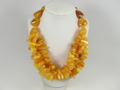 "Chunky gold yellow amber necklace,multi strand statement yellow necklace, beaded yellow necklace, big gold beads, amber statement jewelry,matching earrings available , A bold and dramatic statement necklace featuring acrylic yellow chip beads and huge yellow gemstone imittion beads. 3 strands, light weight. Gold plated lobster clasp Measurements: 19\" (49 cm) plus 3 1/2\" extender Each piece of jewelry from my shop comes beautifully packaged in box and ready for gift giving. Matching earrings a Amber Double Strand Necklaces For Jewelry Making, Handmade Yellow Double Strand Necklace, Handmade Double Strand Yellow Necklace, Handmade Amber Multi-strand Necklace, Yellow Beaded Multi-strand Necklaces, Yellow Double Strand Beaded Necklace, Yellow Multi-strand Jewelry As A Gift, Yellow Multi-strand Necklace For Gift, Yellow Double Strand Jewelry As Gift