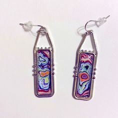 These 2” Long Silver Tone Earrings Feature Swirling Colors Of Blue, Orange, Purple And Green. Artsy Multicolor Rectangular Earrings, Nickel-free Multicolor Rectangular Earrings, Nickel-free Multicolor Artsy Earrings, Artsy Multicolor Nickel-free Earrings, Artsy Multicolor Nickel Free Earrings, Halloween Earrings Beaded, Taco Earrings, Colors Of Blue, Apple Earrings