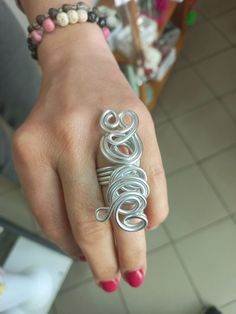 Big Silver Wire Ring, Long Statement Ring, Full Finger Woman's Ring, Unique Handmade Ring Elevate your style with this one-of-a-kind handcrafted aluminum wire ring in a stunning silver hue.  Made from high-quality aluminum, the ring features an intricate wire wrapping technique that adds a touch of elegance and uniqueness to your jewelry collection.  The lightweight nature of the material ensures comfort, making it ideal for everyday wear or special occasions. The package will be sent as soon as Unique Metal Stackable Rings For Anniversary, Handmade Metal Stackable Rings For Anniversary, Handmade Metal Rings For Anniversary, Adjustable Metal Rings, Silver Stackable Rings For Jewelry Making, Handmade Silver Stackable Metal Rings, Silver Wire Wrapped Toe Rings, Adjustable Wire Wrapped Metal Ring, Handmade Metal Stackable Rings For Jewelry Making