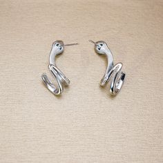 ✰ This delicate jewelry is perfect for people who want to achieve a brilliant and splendid look ✰ This Snake Shaped Earrings not only suitable for formal occasions such as banquets, weddings, theme parties, but also for everyday wear ✰ This delicate jewelry is a very special gift for birthday, Mother's Day, Valentine's Day,Christmas, Winter Clothing and more ✰ Comes with an exquisite gift box Materials: Environmentally-friendly Copper Quantity: 1 pair ----♛ PRODUCTION & SHIPPING ♛ --- ✰ Multiple items purchased in one payment can be combined for shipping ✰ Visit our store, browse other jewelry collections, and find the perfect piece you're looking for：https://www.etsy.com/shop/iCoolJewelry ----♛ Care Tips ♛ --- ✰ Scratches from daily wear are normal, and they can be more noticeable on a la Minimalist Silver Snake-shaped Jewelry, Silver Dangle Hoop Earrings With Plating, Elegant Snake Shape Earrings With Ear Wire, Silver Plated Hoop Earrings As Gift, Silver Snake-shaped Party Earrings, Silver Snake Shape Earrings, Silver Snake-shaped Pierced Earrings, Silver Sterling Silver Snake-shaped Earrings, Earrings Snake