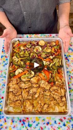 a person holding a tray full of food