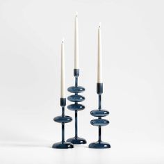 three candles sitting on top of each other