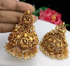 These Jhumka Earrings set have an excellent finish and gives out an exquisite sense of style. Materials: GOLD PLATEDClosure: Push backStyle: Boho & hippiePlease contact us for Bulk Orders.Occasions: Wedding Wear, Party Wear, Festive Wear, Durga Puja, Indian Wear, Sangeet Wear, Bridal Wear, Chrismas Day, Mothers Day, Haldi Wear.NOTE*Actual color may vary slightly from your monitor.*We dispatch the product within 5 days after Confirmation of Payment Received.*Payment accept through PayPal only Temple Jewelry Necklace, Gold Jhumka Earrings, Dangler Earrings, Durga Puja, Earring For Women, Indian Earrings, Gold Earrings Designs, Jhumka Earrings, Indian Traditional