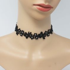 Make an impact everywhere you go when you show up wearing the Astrid Black and Silver Daisy Lace Choker. Each of the tiny flowers is decorated with silver-plated brass beads for a subtle yet eye-catching sparkle. This sexy daisy lace choker is lightweight, flexible, and comfortable to wear for casual or formal occasions or as an everyday statement necklace. Choose between a classic elegant metal clasp + chain or a flirty black silk ribbon to tie your choker in a cute bow. CHOKER SIZE + MATERIALS