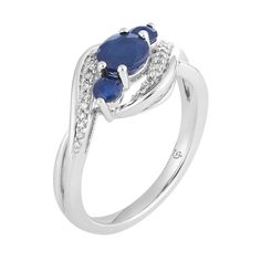 Embellished with round-cut sapphires and diamonds, this 10k white gold three-stone ring is altogether captivating.RING DETAILSWidth: 10.60 mmMetal: 10k white goldPlating: rhodiumFinish: polishedPackaging: boxedSTONE DETAILSStone type: sapphireTotal weight: 1/6 ct.Center stone size: 6 mm x 4 mmShape: roundSetting: prongDIAMOND DETAILSTotal weight: 1/10 ct.Color grade: I-JClarity: I2-I3Shape: roundSetting: prongGemstones may have been treated to enhance their appearance. Special care may be requir Fine Jewelry Three Stone Lab-created Sapphire Ring, Elegant White Gold Three-stone Sapphire Ring, Formal White Gold Three Stone Birthstone Ring, Formal White Gold Three-stone Birthstone Ring, Classic White Gold Three Stone Birthstone Ring, White Gold Diamond Ring With Lab-created Sapphire Accent Stones, Sapphire Three Stone Diamond Ring, Formal 14k White Gold Three-stone Sapphire Ring, Three Stone Diamond Birthstone Ring