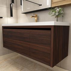 a bathroom with a sink, mirror and wooden cabinet in it's center area