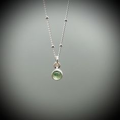 Dainty Green Aventurine Crystal and sterling silver pendant on a sterling silver satellite chain.  A beautifully polished Aventurine crystal encased in sterling silver.  Your choice of either a 14, 16 or 18 inch satellite chain. All of our jewellery comes beautifully gift boxed and bagged along with a description of your crystal's benefits. Our jewellery also makes an amazing gift. We are happy to ship this direct for you with a personal message on one of our handprinted cards.  Just let us know Silver May Birthstone Pendant Necklace, Green Sterling Silver Charm Necklace, Silver Pendant Necklace For May Birthstone, Green Gemstone Sterling Silver Charm Necklace, Green Gemstone Charm Necklace In Sterling Silver, Silver Pendant Crystal Necklace For May Birthstone, Silver Charm Necklace With Round Natural Stone Pendant, Silver Necklace For Everyday With May Birthstone, Green Pendant Birthstone Necklace In Sterling Silver