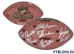 two footballs with signed autographs on the front and back, one in red