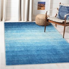 a blue area rug in a living room