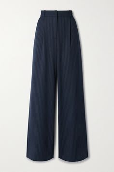 Veronica Beard's 'Heyser' pants are made from navy twill that's woven with subtle metallic pinstripes for an elongating effect and a touch of sparkle. They have soft pleats that enhance the wide legs and can either be worn at the waist or low on the hips, depending on your preference - just choose your size accordingly. Wear them with a collared shirt or chunky sweater. High Waist Bottoms With Vertical Stripes For Business Casual, Elegant Striped Office Pants, Elegant Striped Pants For Office, High Waist Vertical Stripes Bottoms For Business Casual, Pinstripe Wide-leg Workwear Pants, Tailored Pinstripe Wide-leg Pants, Pinstripe Wide-leg Pants For Workwear, Tailored Vertical Stripe Dress Pants For Work, Striped Wide-leg Pants For Work