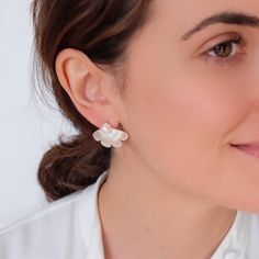 Add a touch of elegance to any ensemble with our Dainty Flower Earrings with Freshwater Pearl. Perfect for weddings and bridesmaids, these chunky daisy flower earrings combine delicate floral design with the timeless beauty of freshwater pearls. Whether for a special occasion or as a thoughtful gift for her, these earrings are sure to be cherished and admired. The natural variations in the pearls ensure each pair is unique, adding to their charm and appeal. Enhance your jewelry collection with these exquisite earrings that effortlessly blend sophistication and style. DETAILED DESCRIPTION// Material: Brass (sterling silver post) Finish: 18 White gold Earrings Size:26*20mm Sold in pairs Niquel free Find more information about the necklace: https://www.etsy.com/listing/1734435194 //OUR COMMIT Silver Feminine Flower Earrings For Formal Occasions, Elegant Petal Shaped Jewelry With 3d Flowers, Elegant Petal-shaped Jewelry With 3d Flowers, White Flower-shaped Pearl Earrings For Formal Events, White Pearl Flower Earrings For Formal Occasion, Elegant Pearl White Jewelry With 3d Flowers, White Pearl Earrings In Flower Shape For Formal Events, White Floral Pearl Earrings For Formal Occasions, White Floral Pearl Earrings For Formal Events