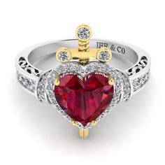 a heart shaped ruby and diamond ring with the initials j p & co on it