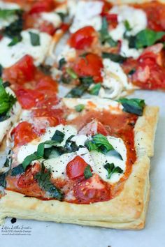 several slices of pizza with tomatoes, basil and mozzarella