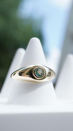 Indulge in the timeless elegance of our 14K gold ring, adorned with a captivating 0.15 ct aquamarine stone, affectionately named "Aqua." Weighing approximately 2.2 grams for size 12, the weight of this exquisite piece may increase or decrease depending on the size you choose., ensuring that it's perfectly tailored to fit you. Rests gracefully in a meticulously crafted gold band, offering a stunning blend of sophistication and minimalist charm, ideal for everyday wear or special occasions. Handcr 14k Gold Emerald Ring With Tension Setting, Blue Dome Ring For Anniversary - Fine Jewelry, Elegant Blue Topaz Gemstone Signet Ring, Elegant Blue Topaz Signet Ring With Gemstone, Luxury Blue Ring With Tension Setting, Timeless 14k Gold Solitaire Topaz Ring, Timeless 14k Gold Round Cut Topaz Ring, Yellow Gold Diamond Ring With Blue Topaz, Timeless 14k Gold Sapphire Ring With Tension Setting