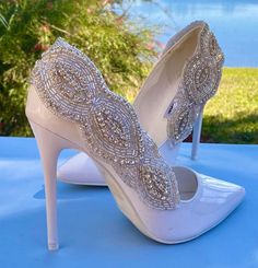 Beautiful shoe clips are the perfect accessory for any simple shoes.  Creates the finishing touch for any outfit.  They measure 9 x 3 inches. Elegant Beaded Party Heels, White Rhinestone Shoe Clips, Wedding High Heels With Bling, Elegant High Heel Wedding Shoes With Bling, Glamorous Embellished Shoe Clips For Prom, Wedding Heels With Bling And Pointed Toe, Glamorous Evening Shoe Clips With Rhinestones, White Crystal Embellished Shoe Clips For Wedding, Glamorous Embellished Shoe Clips For Party