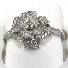 This Is A Flower Rose Diamond Cluster Cocktail Ring. It Is Made Of 100% Natural 14kt White Gold And Is In Brand New Condition. It Has A Ctw Of .45ct And Weighs 2.6 Grams. The Fancy Diamonds Have A Clarity Of Si1 And G Color. This Beautiful Custom Piece Has An Excellent Round Cut Diamond Stone At The Base Of The Ring Unique Solitaire Ring. Samson Diamond 100% Authentic Natural Diamonds, Gemstones, And Gold. Never Lab Created/Synthetic/Fake Merchandise. Silver Diamond Ring With Brilliant Flower Cut, Silver Brilliant Cut Diamond Ring In Flower Shape, Silver Diamond Ring With Brilliant Cut In Flower Shape, Formal White Flower Shaped Diamond Ring, White Gold Flower Diamond Ring Fine Jewelry, White Gold Flower Diamond Ring In Fine Jewelry Style, White Gold Flower Diamond Ring, Diamond White Flower Shaped Platinum Jewelry, Diamond White Flower Ring With Diamond Cut