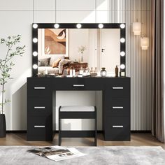 a black vanity with lights on it in a room