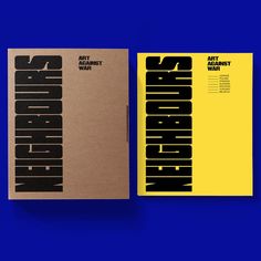 two books with black and yellow covers sitting on top of each other in front of a blue background