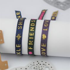 These gorgeous Cute Ribbon Text Bracelets are the perfect gift for BFFs! Buy one and get another for free--it's like a two-for-one deal with double the cuteness! Each set comes mounted on a card and presented in an organza gift pouch, so you can split them up for layering or gift them to your bestie! Now there is no excuse not to have some fun with fashion! Set of two cute Ribbon Text Bracelets that are easy to adjust and one size fits all. The perfect gift for friends to share or keep both to wear and layer. Our cheerful series of ribbon text bracelets are a real must have! Your set of two bracelets are presented on a high quality star print card and sent to you in an organza gift pouch. Choose your favourite text and we'll make sure that bracelet is on the card with one other bracelet fr Trendy Adjustable Wrap Bracelet For Party, Gold Friendship Bracelets With Adjustable Band, Personalized Band Bracelet For Gift, Adjustable Gold Friendship Bracelet For Party, Adjustable Bangle Wrap Bracelet Gift, Adjustable Wrap Bracelet For Gift, Resizable Gold Wrap Bracelet As Gift, Adjustable Wrap Bracelet For Friendship, Adjustable Friendship Bracelets Gift