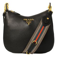 This Prada handbag is a perfect everyday bag. Pebbled black leather paired with orange and blue web stripe nylon strap. The gold Prada logo looks amazing with the black leather. The strap pairs with the classic black leather to add a pop of color to your everyday wardrobe. Wear as a shoulder bag, or as a crossbody. Model: 1BC166 - 1BC052 Black Vitello Phenix leather Gold-tone hardware Top zip closure One interior zip pocket One interior slip pocket Interior signature Prada nylon jacquard lining Prada Purses, Prada Handbag, Fashion Basics, Prada Nylon, Prada Logo, Leather Shoulder Handbags, Prada Crossbody, Prada Bags, Prada Handbags