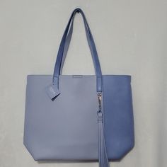 Nwt Ultra Beauty 2 Tone Blue Tote Bag. Very Roomy With Tassel Accent Attached Clip. Blue Trendy Bucket Bag With Handles, Blue Shoulder Bag With Large Capacity For Everyday Use, Blue Large Capacity Shoulder Bag For Everyday Use, Large Capacity Blue Shoulder Bag For Everyday Use, Light Blue Double Handle Shoulder Bag For Daily Use, Trendy Blue Shoulder Bag For Daily Use, Light Blue Double Handle Shoulder Bag, Chic Blue On-the-go Bags, Light Blue Bag With Adjustable Strap For Daily Use