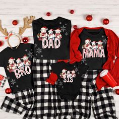 **Note your items will be printed on white and PJ Bottoms not included.  These are not intended to be used as Pajamas. Capture those picture-perfect Holiday Christmas moments with our Matching Family Christmas Shirts! These  Personalized Christmas Family T-Shirts, are designed to make your Christmas Family photos unforgettable.   You'll have an adorable  look that's both fun and festive with our  Custom Christmas Shirts With Name. WHY YOU"LL LOVE IT: This classic unisex jersey short sleeve tee f Black Cartoon Print T-shirt For Winter, Black Cartoon Print T-shirt, Family Matching Long Sleeve Christmas T-shirt, Christmas Printed Crew Neck Top, Christmas Long Sleeve Tops With Character Print, Holiday Crew Neck Top With Cartoon Print, White Christmas Tops With Cartoon Print, Black Top As Christmas Gift, White Christmas Cartoon Print Tops