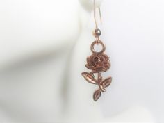 Long Stem Rose in Rose Gold dangle earrings.     Rose Gold plated alloy nickel and lead safe.    Matching Necklace Available All items in stock and ships next day from Tennessee. Free Shipping Rose Gold Metal Drop Flower Earrings, Rose Gold Metal Drop Earrings, Rose Metal Jewelry For Gift, Rose Colored Dangle Jewelry With Rose Design, Rose-colored Drop Earrings With Rose Design, Rose Design Drop Earrings In Rose Color, Long Stem Rose, Rose Gold Dangle Earrings, Ankh Necklace