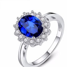 "Princess Diana" luxury gemstone ring with blue sapphire stone and 925 sterling silver is the perfect gift as an engagement ring for a woman. Specification: Style: BohemiaModel Number: SR0078Item Type: RingsGender: WomenMain Stone: SAPPHIREShape Pattern: OvalSide Stone: Other Artificial materialMetal: 925 Sterling SilverSilver Content:at least 92.5%Occasion: Engagement, Wedding, AnniversarySize: 5 6 7 8 9Net Weight: 3.76g Sapphire Blue Weddings, Cubic Zirconia Wedding Rings, Sterling Silver Promise Rings, Ring Trends, Blue Ring, Mail Delivery, Sterling Silver Engagement Rings, Rhinestone Ring, Zircon Ring