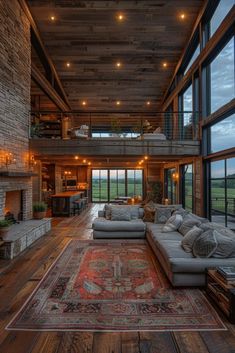 a large living room filled with furniture and windows