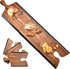 a wooden board with pieces of food on it