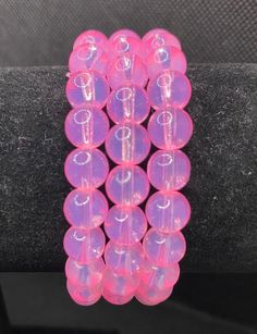 Add style to your outfit with this stunning transparent pink 8mm glass beaded bracelet. The glass beads have a high shine and glow with every movement. Made with strong, durable elastic string that allows the bracelet to be flexible, stretch to a comfortable fit and have effortless wear for most wrist. Bracelet lengths available are from 5 inches to 8 inches.  If needed Contact us to request custom sizes with no extra charge. Handmade with passion, this bracelet will make your wrist stand out. From a casual day wear to a special occasion, this bracelet is the perfect accessory to express our style. A great gift for yourself, loved ones, friends and family who loves beautiful jewelry. The price shown is for one bracelet. To keep in best condition, don't expose bracelet to extreme temperatur Pink Spacer Beads Bracelets For Party, Pink Party Bracelets With Spacer Beads, Adjustable Pink Beaded Bracelets With 8mm Beads, Pink Beaded Stretch Bracelet For Party, Pink Faceted Beads Bracelets For Party, Pink Adjustable Crystal Bracelet With Round Beads, Pink Beaded Bracelets For Party With Round Beads, Adjustable Pink Crystal Bracelet With Round Beads, Pink Beaded Bracelets With Round Beads For Party