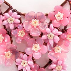 pink flowers are arranged in the shape of a heart