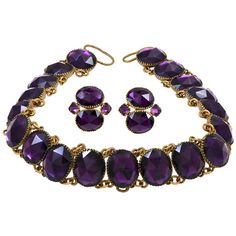 Amazing "Queen Anne" amethyst paste necklace set in gilt metal. Please Note: The earrings are not included. This style of jewelry was misnamed for Queen Anne, who reigned from 1695 to 1714, as the necklace was made in the mid 18th century. The necklace is comprised of non-graduated rivieres. The vivid purple paste stones used are faceted as rose cuts and collet-set. The necklace fastens with a ribbon. The paste stones run 10.5 inches while the ribbon makes up the rest of the length of the neckla 18th Century Jewelry, Paste Jewelry, Riviere Necklace, Vintage Choker Necklace, Georgian Jewelry, Ribbon Jewelry, Jewelry Styles, Vintage Choker, Earrings And Necklace